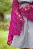 Armeria Wrap Knitting Pattern, worked with 2 strands of lace-weight yarn this pattern blends color by using 2 strands of 1 color, or 1 strand of 2 colors at the same time. Worked bottom up with an enjoyable lace pattern this wrap uses 100% cashmere yarn for a sumptuous ombre masterpiece! Check out this gorgeous knit design by Meghan Jones with yarn from Lux Adorna Knits today!