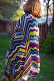 Lindy Pop: knitting pattern by Meghan Jones. Loads of fringe edge a stripey bias lace and twisted stitches shawl.