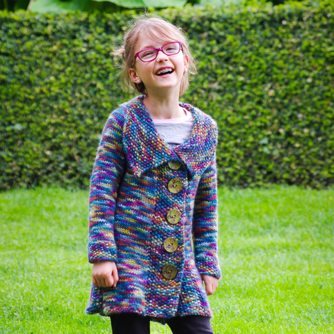 Milieu Panache is an upsized version of the popular Petite Panache pattern, worked in one piece from the bottom up with pleating and seed stitch this adorable tunic length coat is now available in sizes 6-12 years.  Knitting pattern, Meghan Jones, kids knits, sweater, cardigan, pleating, seed stitch, tunic, chunky yarn