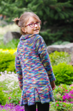 Milieu Panache is an upsized version of the popular Petite Panache pattern, worked in one piece from the bottom up with pleating and seed stitch this adorable tunic length coat is now available in sizes 6-12 years.  Knitting pattern, Meghan Jones, kids knits, sweater, cardigan, pleating, seed stitch, tunic, chunky yarn