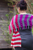 Tabulated Shawl by Meghan Jones, Worked from narrow end to wide end this fun shawl is mostly garter stitch with alternating gradient colors. The border is worked at the same time as the garter stitch section and features double yarnovers and wrapped stitches with a wide fringed edge. Knitting, pattern, lace, shawl, gradient yarn, stripes, easy knit. 